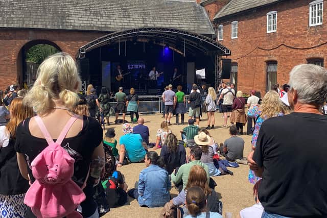The courtyard stage in the sunshine on Sunday Morning