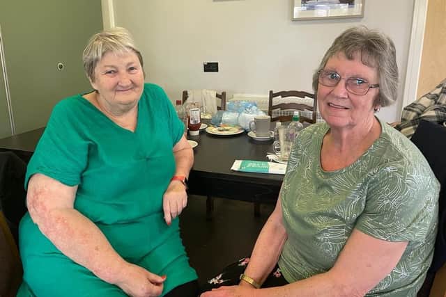 Gina Dolan, left, charity manager for Rumbles, pictured with regular customer Annette Weightnan, 78. (Photo: Andrew Topping)