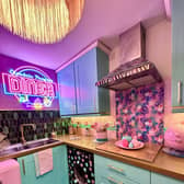 A couple have transformed their “boring” new build home into a pink paradise themselves in 18 months – despite being DIY novices.