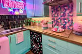 A couple have transformed their “boring” new build home into a pink paradise themselves in 18 months – despite being DIY novices.