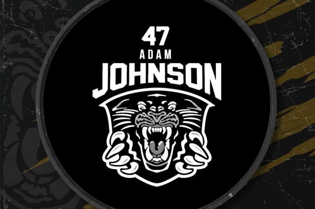 The commemorative puck features Adam Johnson's number 47 