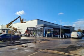 Builders were putting the finishing touches to the supermarket 10 days ahead of opening.