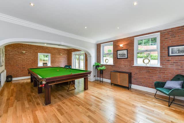 The games room with fitted bar is ideal for entertaining 