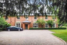 The stunning property boasts a large driveway with space for several cars 