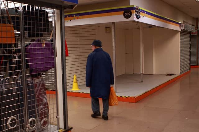 Sad scenes as curious customers walk around the largely empty market 