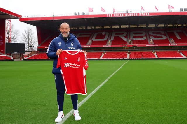 Nuno Espirito Santo poses for a photo with the Nottingham Forest shirt on the pitch, as they are unveiled as the new Nottingham Forest manager during a press conference at City Ground