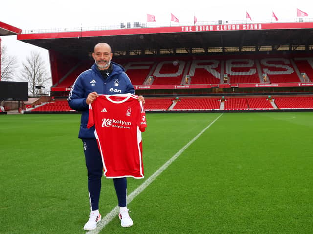 Nuno Espirito Santo poses for a photo with the Nottingham Forest shirt on the pitch, as they are unveiled as the new Nottingham Forest manager during a press conference at City Ground