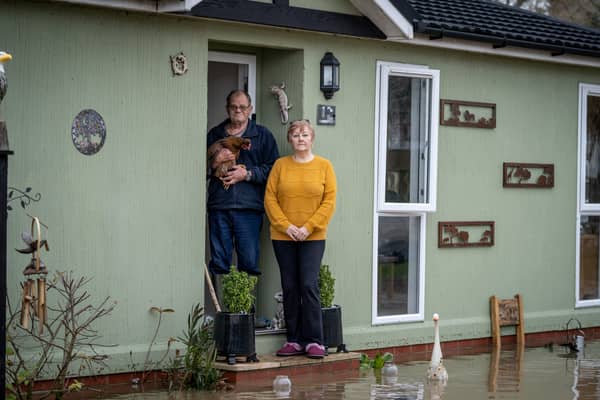 Sue and Hans Oosthuizen are trapped by flood water on Radcliffe Residential Park, Nottinghamshire