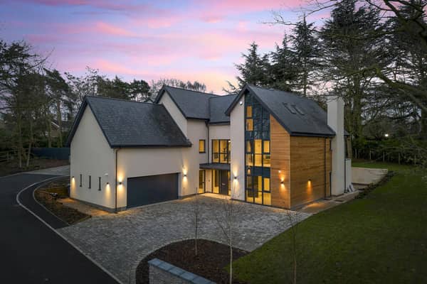 The slick property with monochromatic interior is on the market for £1.7m 