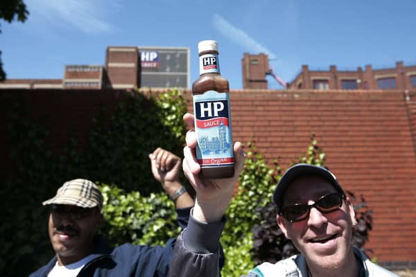 Workers and supporters from Birmingham's HP Sauce company march outside the factory against closure on June 3, 2006,