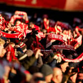 Nottingham Forest fans hold their scarves aloft
