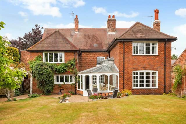 This property boasts a lovely conservatory and manicured lawn