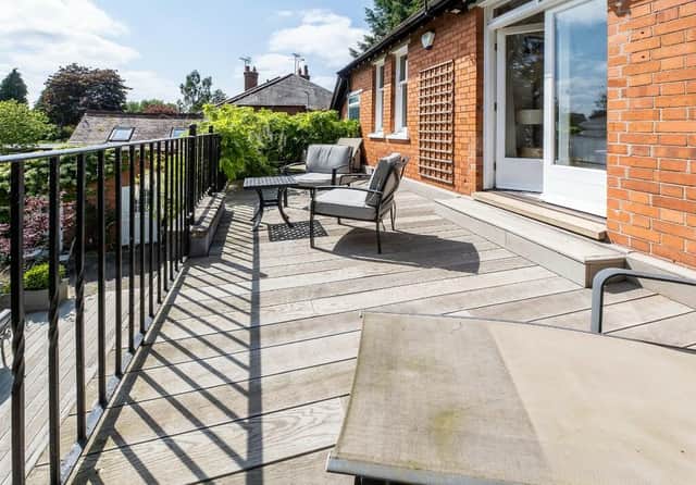This house has a huge terraced balcony with views over the pretty garden