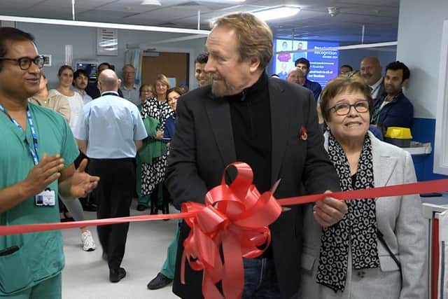 Kevin Freestone, James's dad, cutting the ribbon as the stroke service is expanded