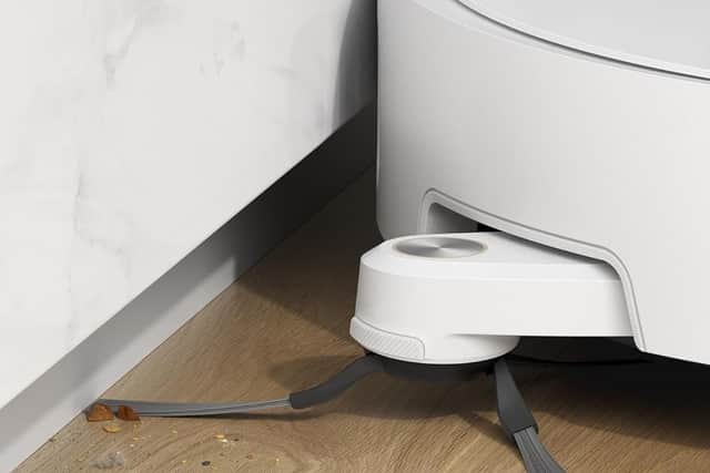 An extendable brush system helps the robot reach right into the sides of your indoor space