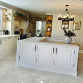 Mrs Hinch uses adjustable organisers to keep things like food neatly organised in her kitchen (pictured).