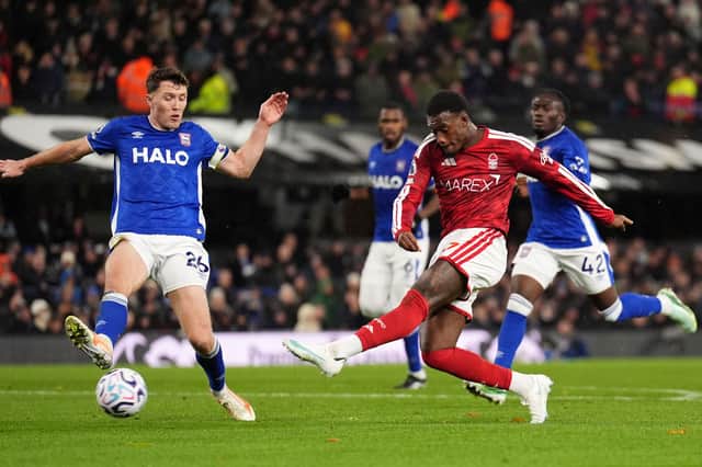 Nottingham Forest's Callum Hudson-Odoi takes a shot on goal while being challenged by Ipswich Town defender Dara O'Shea