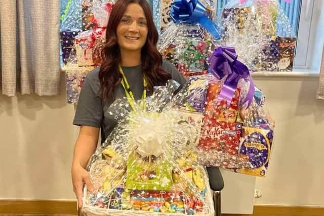 Cygnet Manor staff show off their Easter raffle prizes to raise money for the charity.