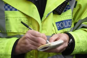 File photo dated 22/10/14 of a police officer making notes. Shop owners have asked the Home Secretary to specifically outlaw attacks on retail workers. The Government should create a new offence of assaulting, threatening or abusing a retail worker, dozens of business leaders said.